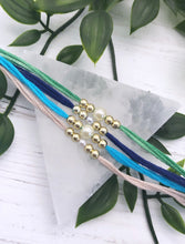 Load image into Gallery viewer, Bundle of 5 Simple Pearl Rakhi / Rakhri