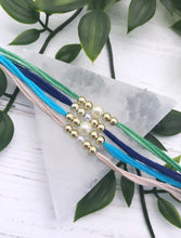 Load image into Gallery viewer, Note of Love Simple Pearl Rakhi / Rakhri
